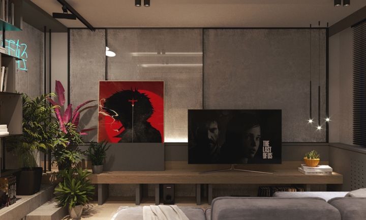  Các chậu cây lớn tập trung ở cuối phòng khách nơi gần giá sách.